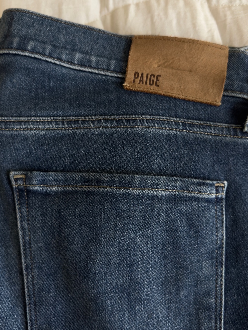 PAIGE Slim Men’s Jeans in Medium Blue with Brown Patch
